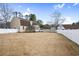 Expansive backyard with white fencing, detached garage, and stair access to the second story at 112 Staton Ln., Longs, SC 29568