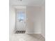 Entryway features white walls, ceramic tile flooring, and a white front door at 112 Staton Ln., Longs, SC 29568