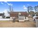 Back exterior view showcasing a balcony with stairs leading to the spacious backyard at 112 Staton Ln., Longs, SC 29568