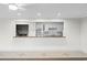 Bright, updated kitchen with breakfast bar overlooking living area with recessed lighting at 112 Staton Ln., Longs, SC 29568