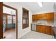 Traditional kitchen features wood cabinets, stainless steel dishwasher, and tile floors at 112 Staton Ln., Longs, SC 29568