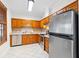 Traditional kitchen featuring stainless appliances, wood cabinets, tile flooring and countertops at 112 Staton Ln., Longs, SC 29568