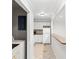 Updated kitchen with white cabinets and appliances located off laundry room at 112 Staton Ln., Longs, SC 29568