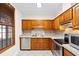Kitchen featuring wooden cabinetry, stainless steel appliances, and tile countertops at 112 Staton Ln., Longs, SC 29568