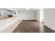 Open living space with laminate floors, white walls, and access to the kitchen at 112 Staton Ln., Longs, SC 29568