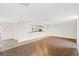 Bright, open living room with wood floors and view to updated kitchen with breakfast bar at 112 Staton Ln., Longs, SC 29568