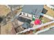 Aerial view of a backyard with a pool, a patio, and a white privacy fence at 1209 Peyton Ct., Myrtle Beach, SC 29588
