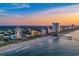 Aerial view of a beach and coastline including high-rise hotels, beach, and the SkyWheel at 1209 Peyton Ct., Myrtle Beach, SC 29588