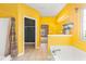 Bright bathroom with double vanity, soaking tub and yellow walls at 1209 Peyton Ct., Myrtle Beach, SC 29588