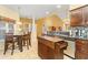 Bright, open kitchen with a center island and adjacent dining area with natural lighting at 1209 Peyton Ct., Myrtle Beach, SC 29588