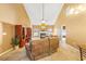 Spacious living room with high ceilings, plush seating, fireplace, and natural light at 1209 Peyton Ct., Myrtle Beach, SC 29588