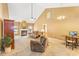 Large living room featuring high ceilings, plush sofas, fireplace, and a view into adjacent rooms at 1209 Peyton Ct., Myrtle Beach, SC 29588