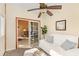 Bright sun room with white sofa and view to the adjacent room through sliding glass door at 1209 Peyton Ct., Myrtle Beach, SC 29588