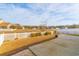 Large backyard with a patio, white fence, and a view of neighboring homes at 1325 Cascarilla Ct., Myrtle Beach, SC 29579