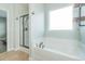Bathroom with soaking tub, shower, and a large window at 1325 Cascarilla Ct., Myrtle Beach, SC 29579