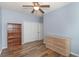 Spacious bedroom with double closets, ceiling fan, and wood-look floors at 1325 Cascarilla Ct., Myrtle Beach, SC 29579