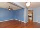 Light-filled dining area with hardwood floors and blue walls at 1325 Cascarilla Ct., Myrtle Beach, SC 29579