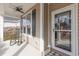 Inviting front porch with rocking chair, ceiling fan, and stylish door at 1325 Cascarilla Ct., Myrtle Beach, SC 29579
