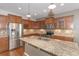 Well-equipped kitchen featuring granite counters and stainless steel appliances at 1325 Cascarilla Ct., Myrtle Beach, SC 29579