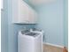 Laundry room with white cabinets and washer and dryer included at 1325 Cascarilla Ct., Myrtle Beach, SC 29579