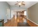 Open living room with hardwood floors, high ceilings, and a view into the kitchen at 1325 Cascarilla Ct., Myrtle Beach, SC 29579