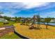 Community playground with modern equipment near a pond at 1325 Cascarilla Ct., Myrtle Beach, SC 29579