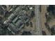 Aerial view of property showing community layout, parking, proximity to a highway, and adjacent golf course at 1432 Highway 544, Conway, SC 29526