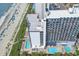 Aerial view of a beachfront high-rise building with pools at 2001 S Ocean Blvd. # 1401, Myrtle Beach, SC 29577