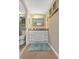 Bathroom with granite vanity and a large mirror at 2001 S Ocean Blvd. # 1401, Myrtle Beach, SC 29577
