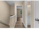 Upstairs hallway leading to a bathroom and a bedroom with natural light at 207 Townes Ct., Myrtle Beach, SC 29588