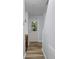 Hallway featuring hardwood floors, an exterior door, and stairs at 207 Townes Ct., Myrtle Beach, SC 29588