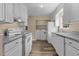 Bright kitchen features white appliances and ample granite counter space at 207 Townes Ct., Myrtle Beach, SC 29588