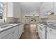Modern kitchen with white cabinets, granite countertops, and stainless steel appliances at 207 Townes Ct., Myrtle Beach, SC 29588