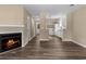 Inviting living room with a fireplace, neutral walls, and open access to the kitchen at 207 Townes Ct., Myrtle Beach, SC 29588