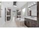 Spa-like bathroom with marble tile, double vanities, and a large soaking tub at 215 82Nd Ave. N, Myrtle Beach, SC 29572
