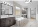 Elegant bathroom featuring double sinks, a freestanding tub, and a walk-in shower at 215 82Nd Ave. N, Myrtle Beach, SC 29572