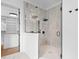Modern bathroom with a frameless glass shower and marble tile at 215 82Nd Ave. N, Myrtle Beach, SC 29572