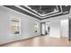 Spacious bedroom with hardwood floors and barn door leading to bathroom at 215 82Nd Ave. N, Myrtle Beach, SC 29572
