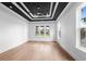 Bright bedroom with hardwood floors and tray ceiling, offering ample natural light at 215 82Nd Ave. N, Myrtle Beach, SC 29572