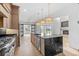 Gourmet kitchen boasts modern appliances and expansive island at 215 82Nd Ave. N, Myrtle Beach, SC 29572