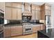 Bright kitchen features stainless steel range and granite countertops at 215 82Nd Ave. N, Myrtle Beach, SC 29572