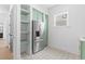 Kitchen features stainless steel appliances and custom green cabinetry at 215 82Nd Ave. N, Myrtle Beach, SC 29572