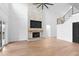 Living room with hardwood floors, fireplace, and high ceilings at 215 82Nd Ave. N, Myrtle Beach, SC 29572
