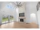 Two-story living room with hardwood floors, fireplace, and access to backyard at 215 82Nd Ave. N, Myrtle Beach, SC 29572