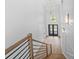 Elegant staircase with wood railing leading to upper level at 215 82Nd Ave. N, Myrtle Beach, SC 29572
