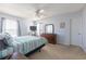 Bright bedroom boasts a large dresser, ceiling fan, and a door at 2268 Essex Dr. # L, Surfside Beach, SC 29575