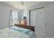 This cozy bedroom features a bed, dresser, window and large closet at 2268 Essex Dr. # L, Surfside Beach, SC 29575