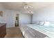 Spacious bedroom features an en-suite bathroom, dresser and ceiling fan at 2268 Essex Dr. # L, Surfside Beach, SC 29575