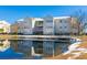 Exterior building view with a pond in the foreground, showcasing well-maintained grounds at 2268 Essex Dr. # L, Surfside Beach, SC 29575
