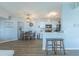 Stylish living area with dining table, kitchen bar, and hardwood flooring at 2268 Essex Dr. # L, Surfside Beach, SC 29575